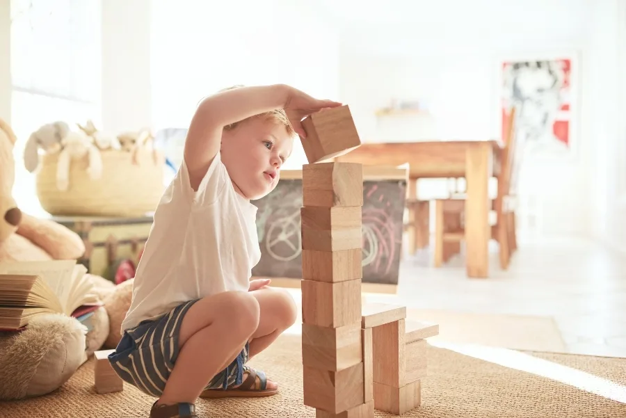 Little boy stacking blocks