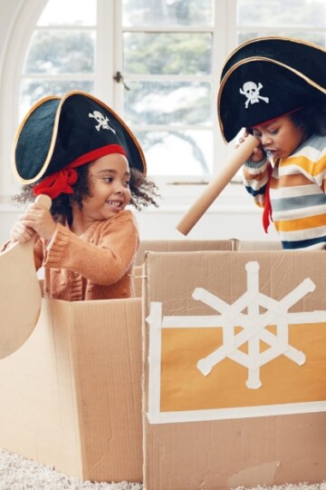 Two kids playing pirates for pretend play