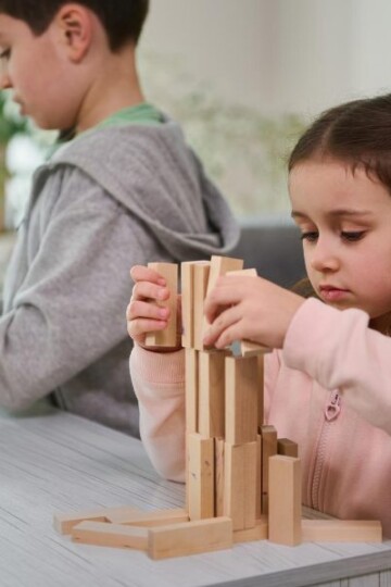 Two kids stacking blocks