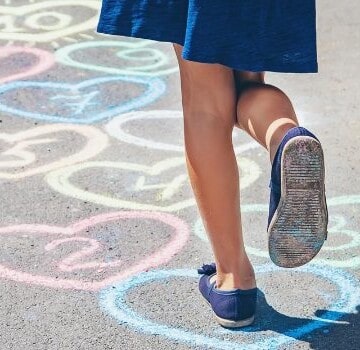 Little girl doing hopscotch