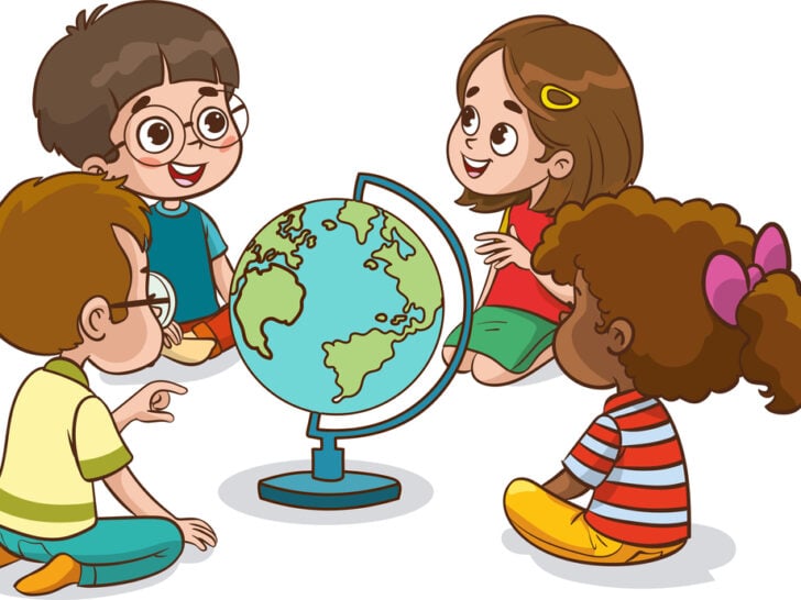 Four young, multicultural children sitting around a globe of the world