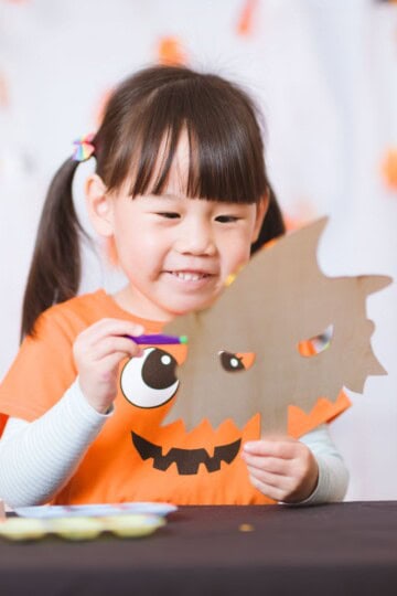 Child doing Halloween crafts