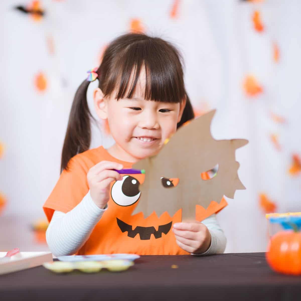 Child doing Halloween crafts