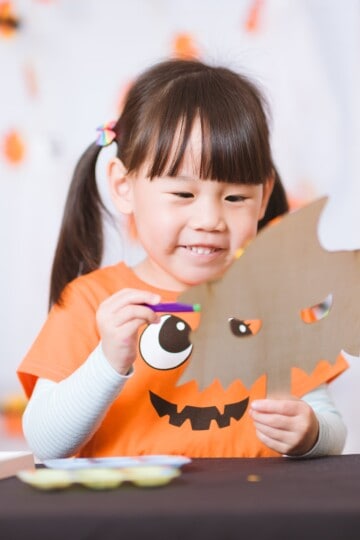 Child doing Halloween crafts