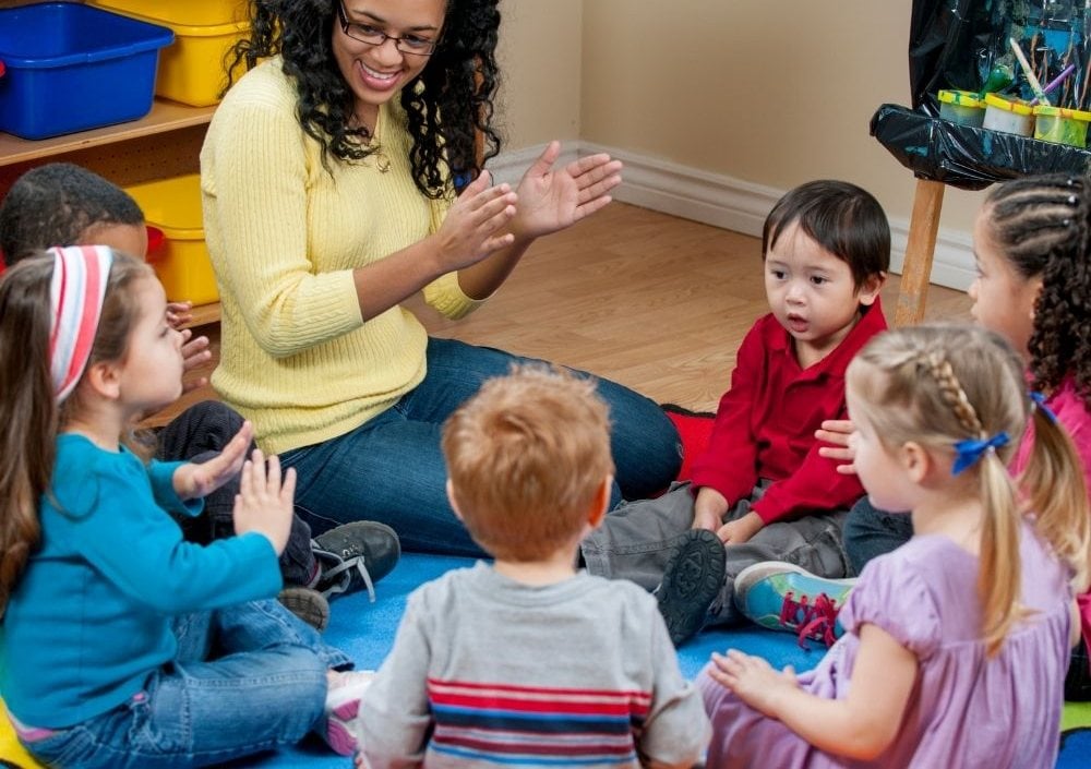 Preschool teacher leading circle time
